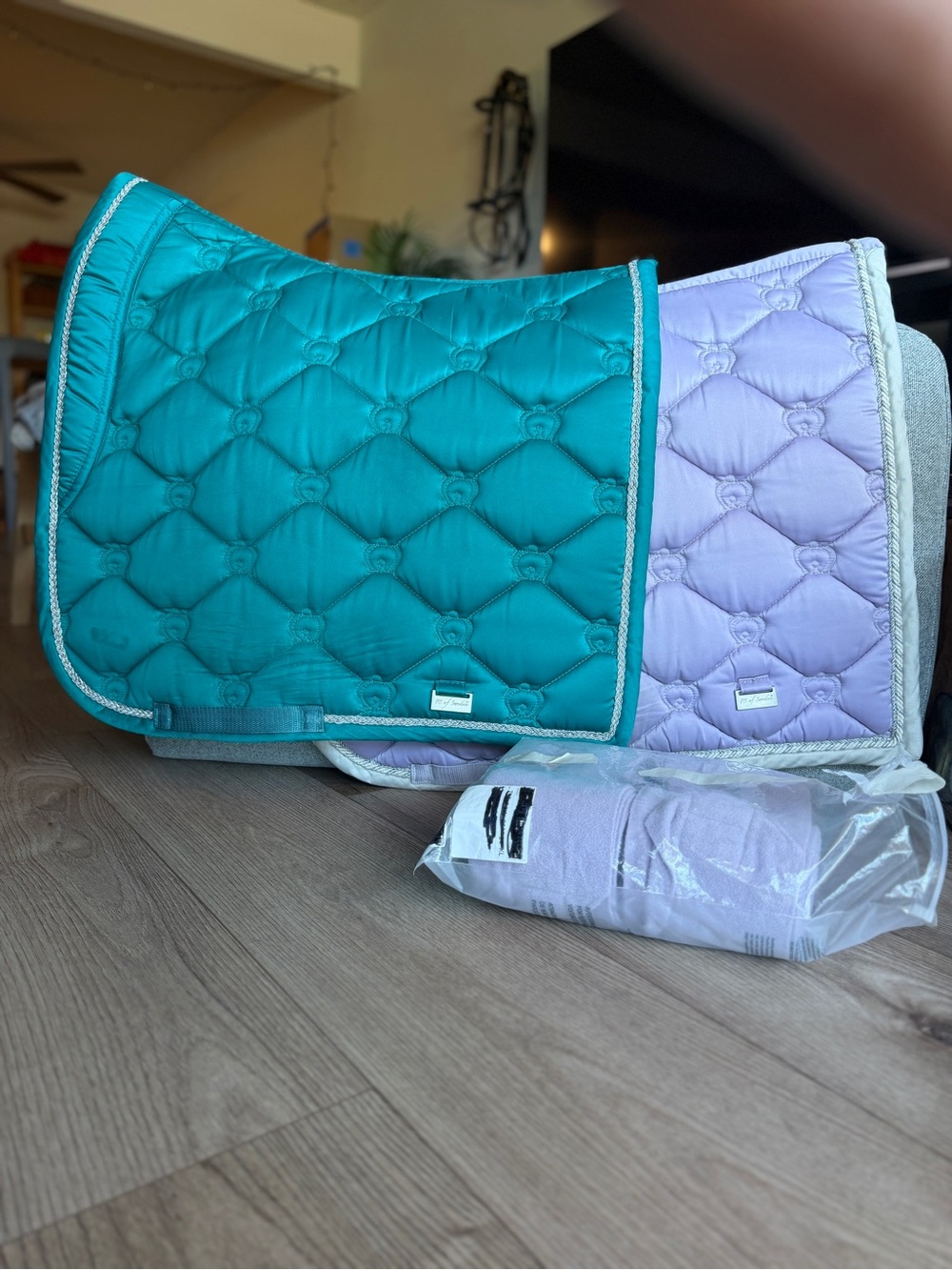 A bundle of two PS of Sweden dressage saddle pads